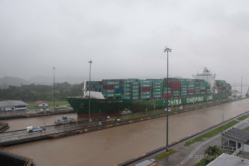 20101202_152223 D3.jpg - Miraflores Locks, Panama Canal. Note the 4 'engines' that pull the ship through the lock.  Canal captains take charge of the ship